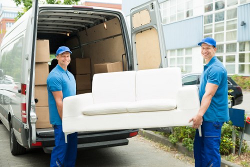 Removals team preparing items for transport from a Bow flat