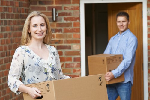 Removal staff using safe lifting methods during a move