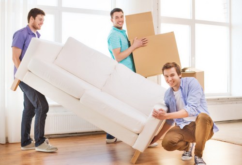 Moving boxes and household items with a van in Bow