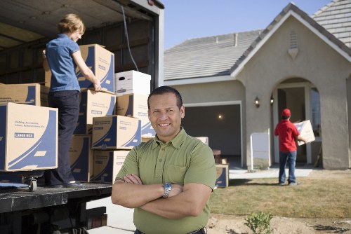 Local removal team planning a move in Bow with boxes and furniture