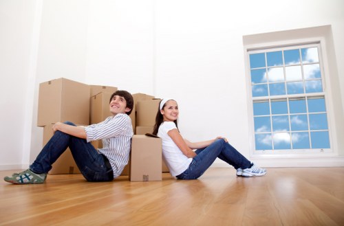 Moving crew loading furniture into a removal vehicle