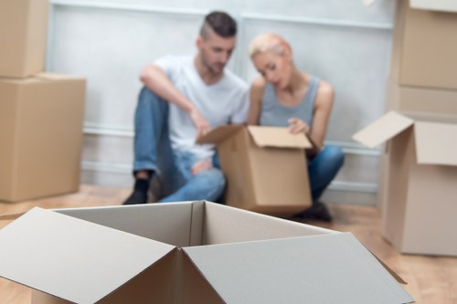 Moving large furniture through a residential building in Bow