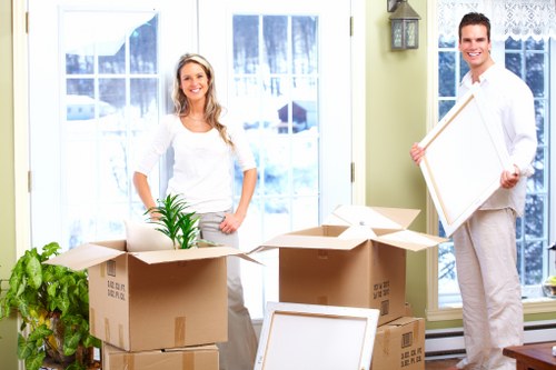 Staff preparing desks and boxes during an office move in Bow